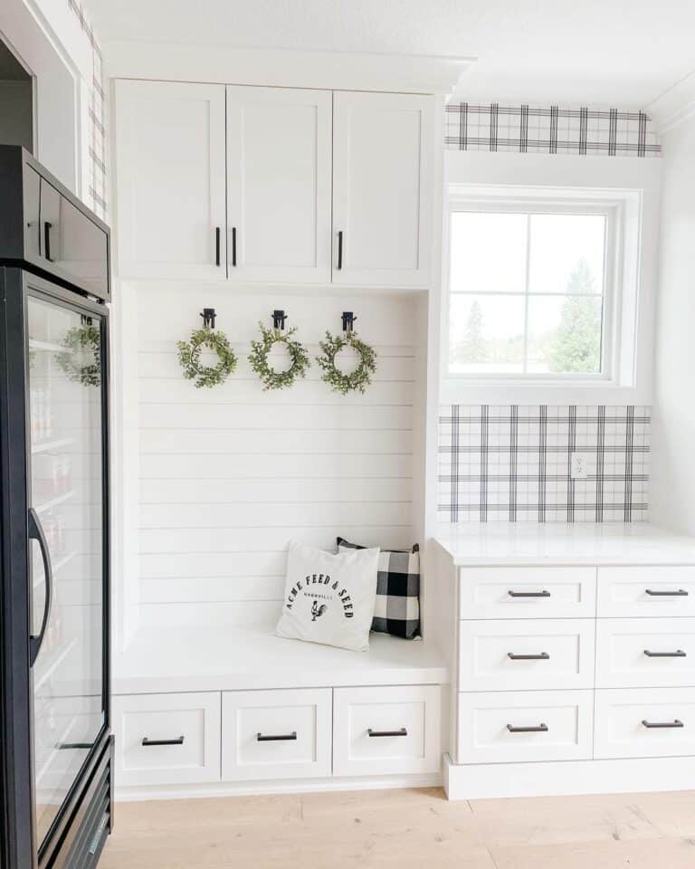 White Farmhouse Mudroom With Shiplap Wall
