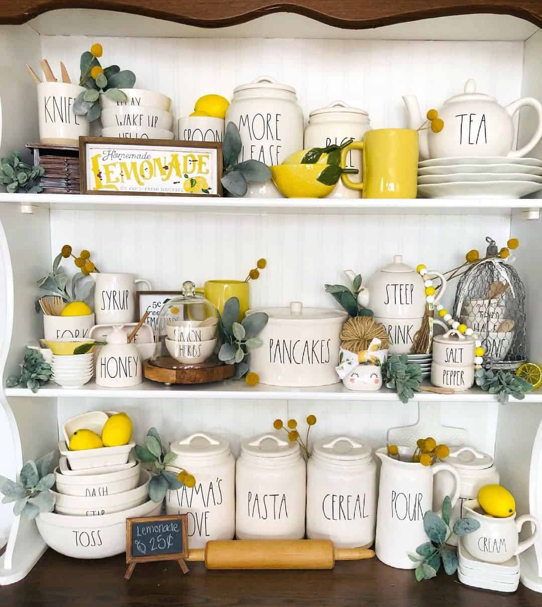 https://www.soulandlane.com/wp-content/uploads/2023/06/White-Hutch-With-Kitchen-Canisters-and-Lemons.jpg