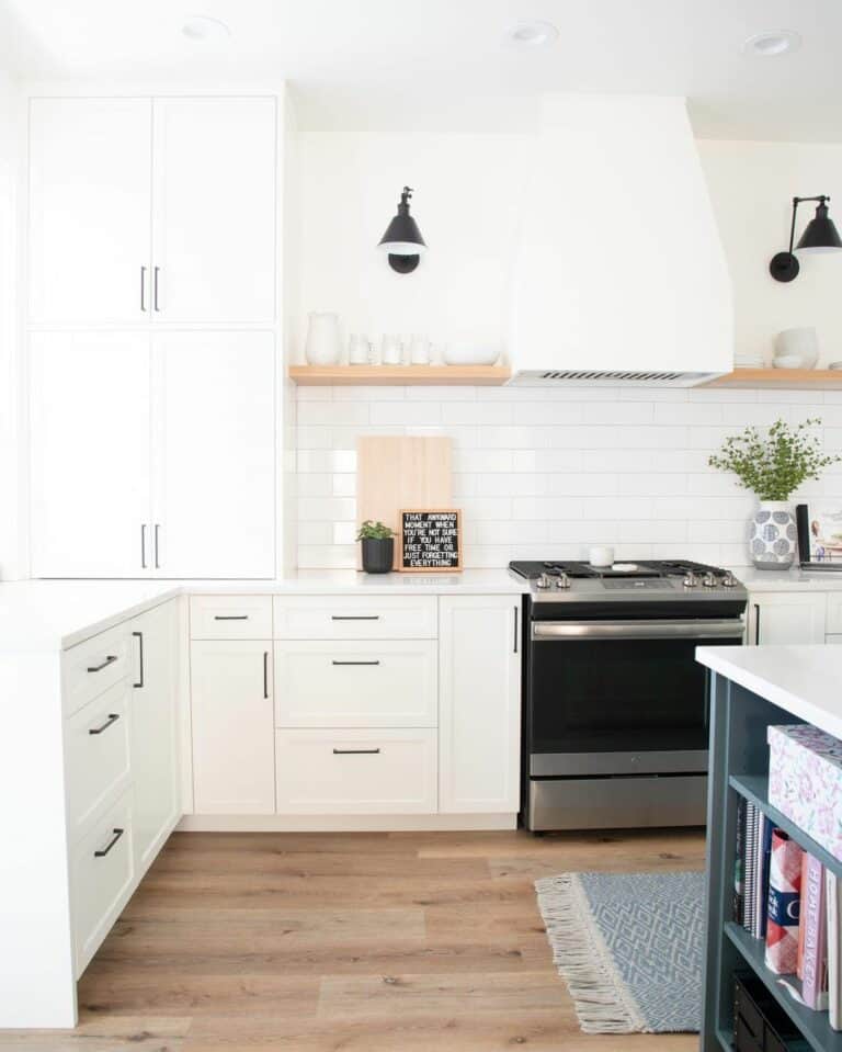 White Kitchen With Black Wall Lamps