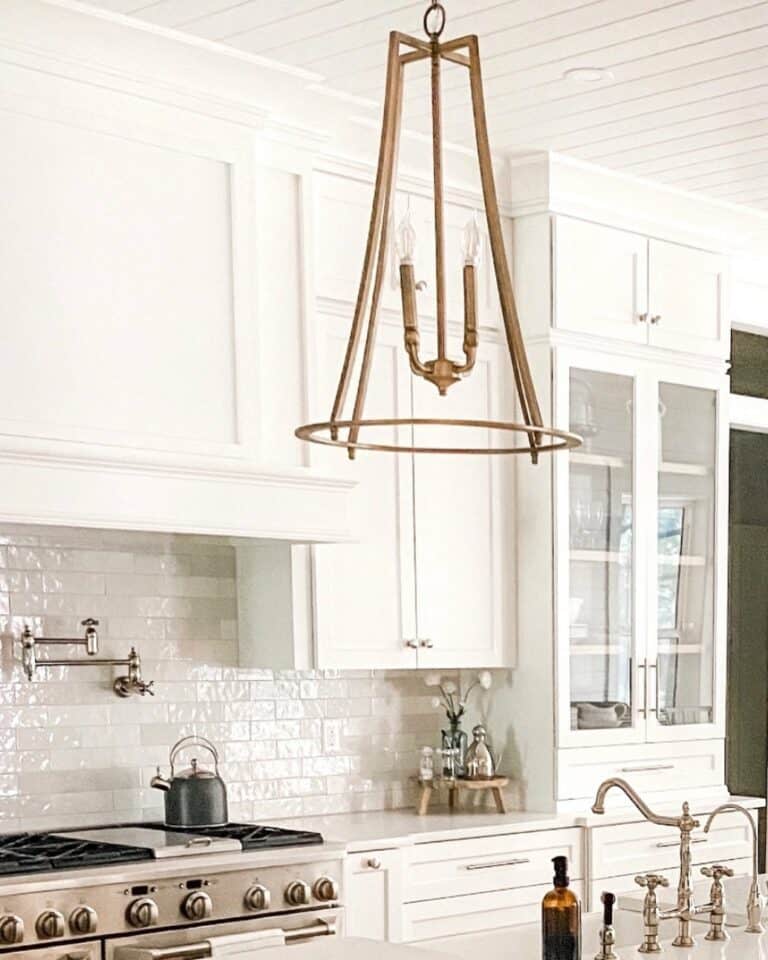 White Kitchen With Brass Chandelier Light Fixture