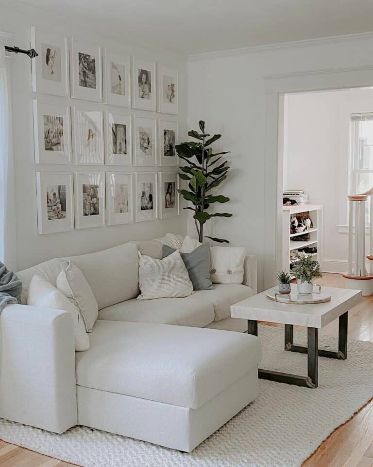 White Living Room With Framed Photographs