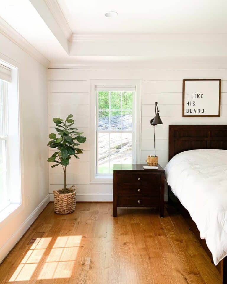 White Shiplap Walls and Mahogany Nightstand in Bedroom