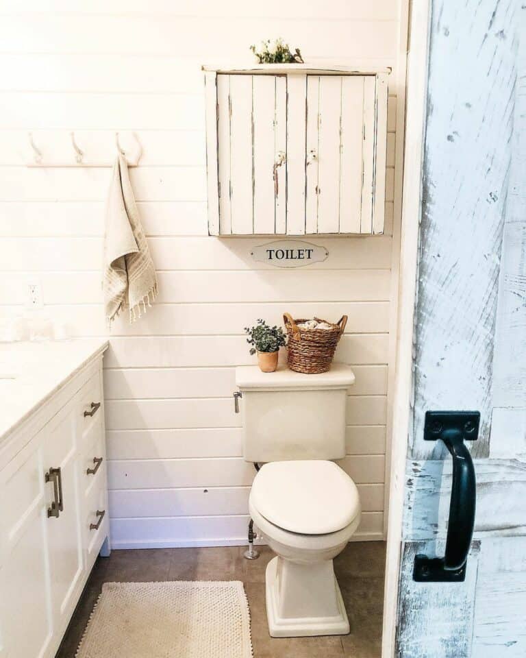 White Shiplap and Rustic Bathroom Cabinetry Accents