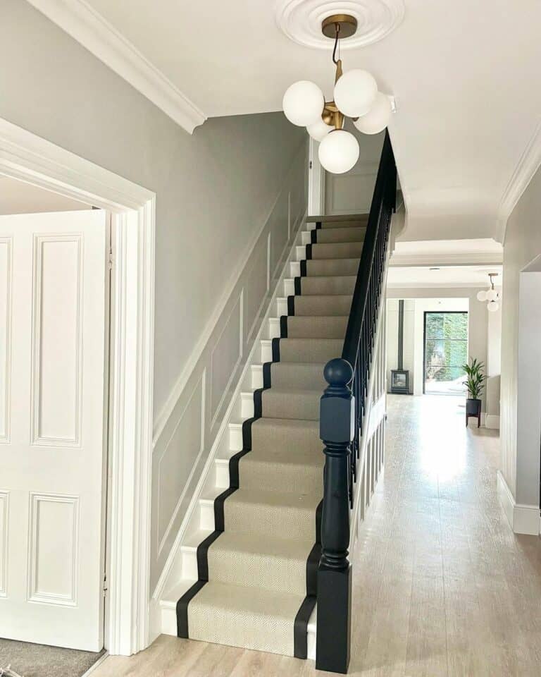 White and Black Stairs With Beige Stair Runner