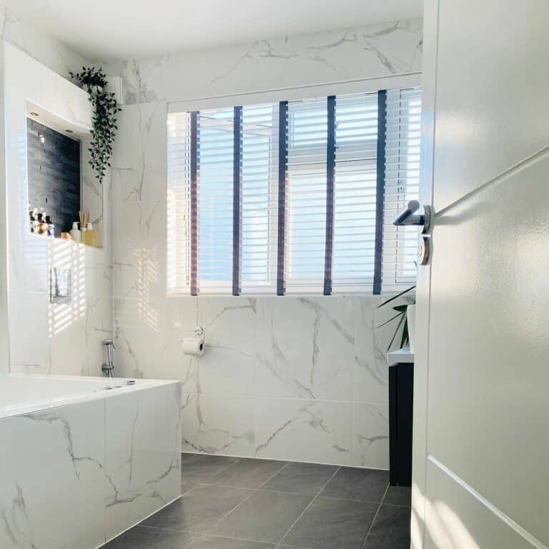 White and Gray Bathroom With Marble Accent Wall