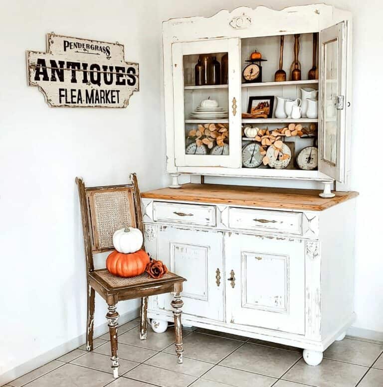 Rustic Wood Chair With White and Orange Pumpkins