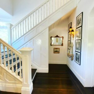 Switchback Staircase With White Balusters
