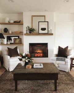 White Fireplace With White Slipcovered Armchairs