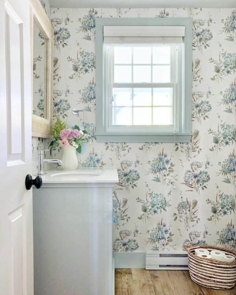 Airy Bathroom With White and Blue Floral Wallpaper