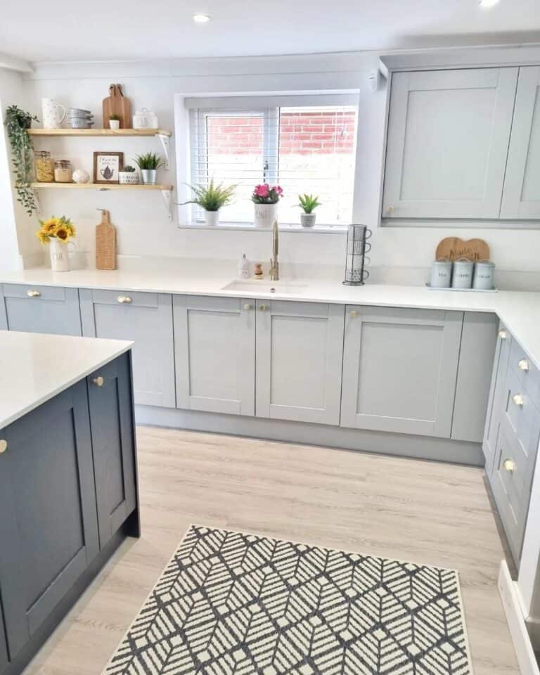 Airy Kitchen With Multi-toned Gray Cabinets