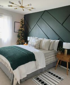 Bedroom With Dark Green Geometric Wall Paneling