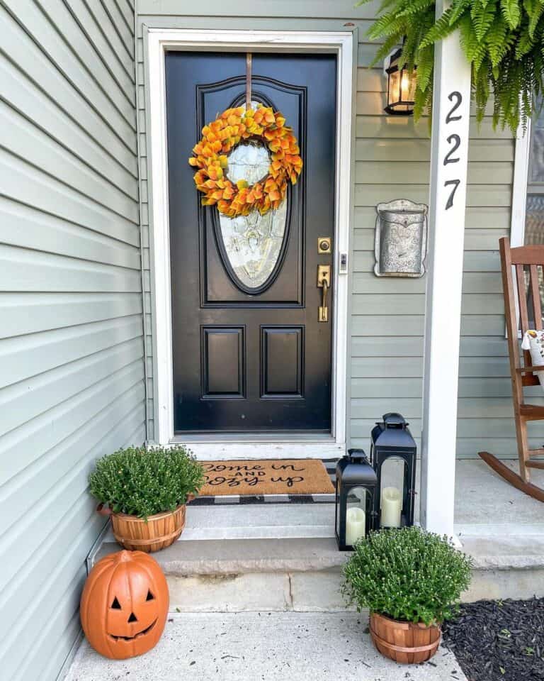 Black Front Door With Orange Wreath