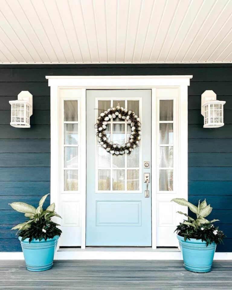 Blue Planters Surround a Front Door