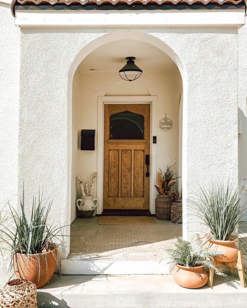 Bohemian Entryway With Wooden Front Door