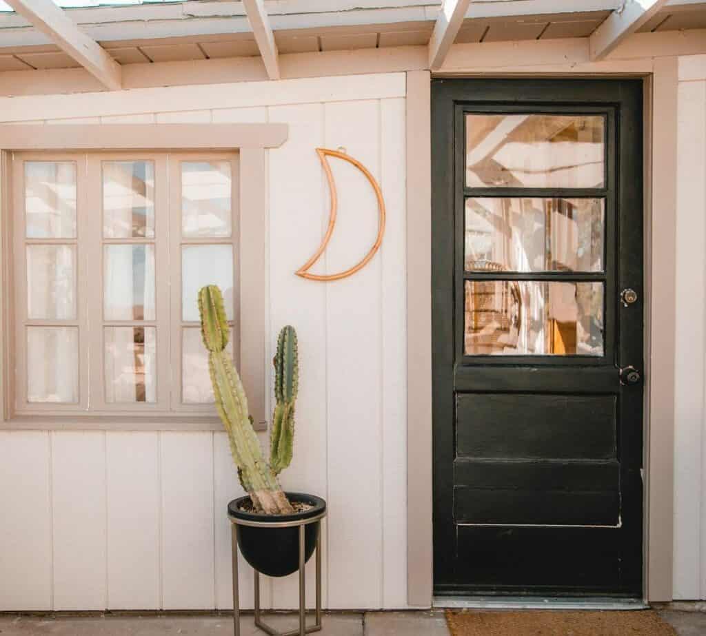 Bohemian Porch With Black Front Door