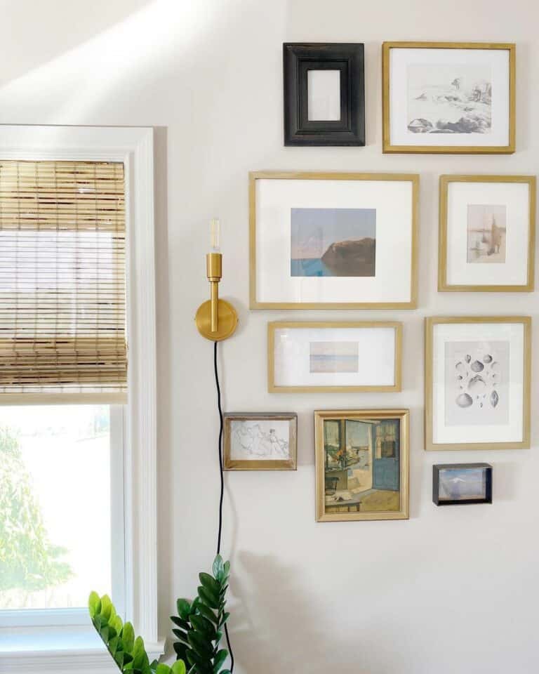 Brass Sconce Illuminates a Gallery Wall