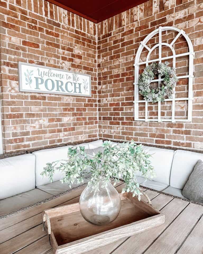 Brick Porch With Farmhouse Outdoor Accents