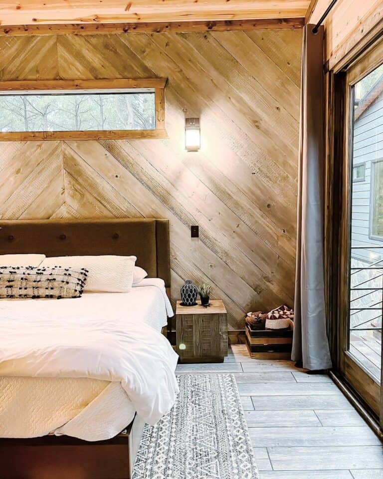 Cabin Bedroom With Wood Chevron Accent Wall