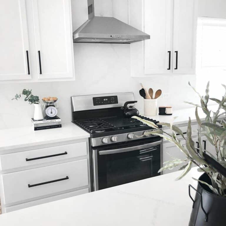 Contemporary Kitchen With Stainless Steel Vent Hood