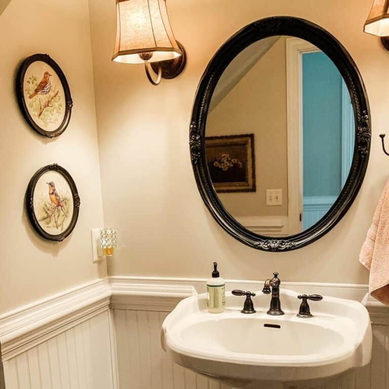 Country Bath With Black Frame Oval Mirror
