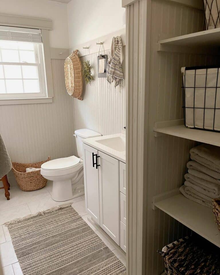 Cozy Bathroom With Gray Linen Closet