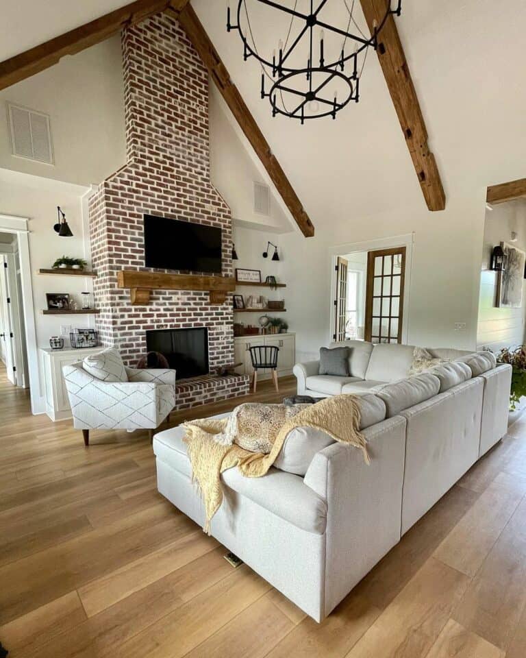 Cozy Living Room With Tall Brick Fireplace