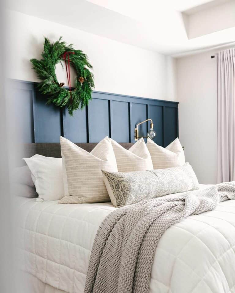 Cozy White and Blue Bedroom With Christmas Wreath