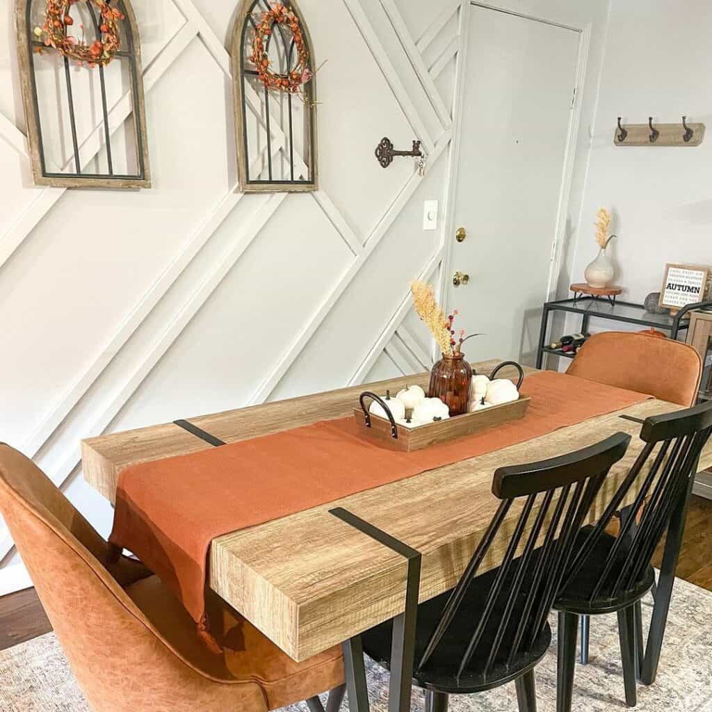 Dining Room With White Geometric Paneling