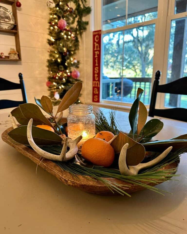 Dining Table Centerpiece With Magnolia Leaves and Pine Needles