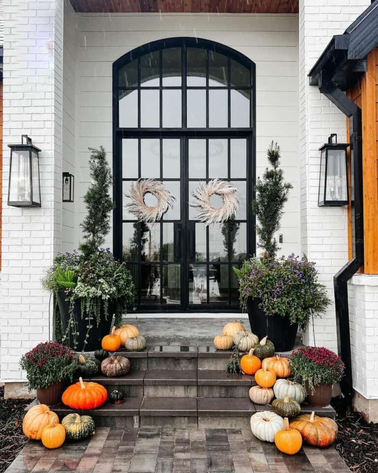 Dramatic White Porch With Pumpkin Décor