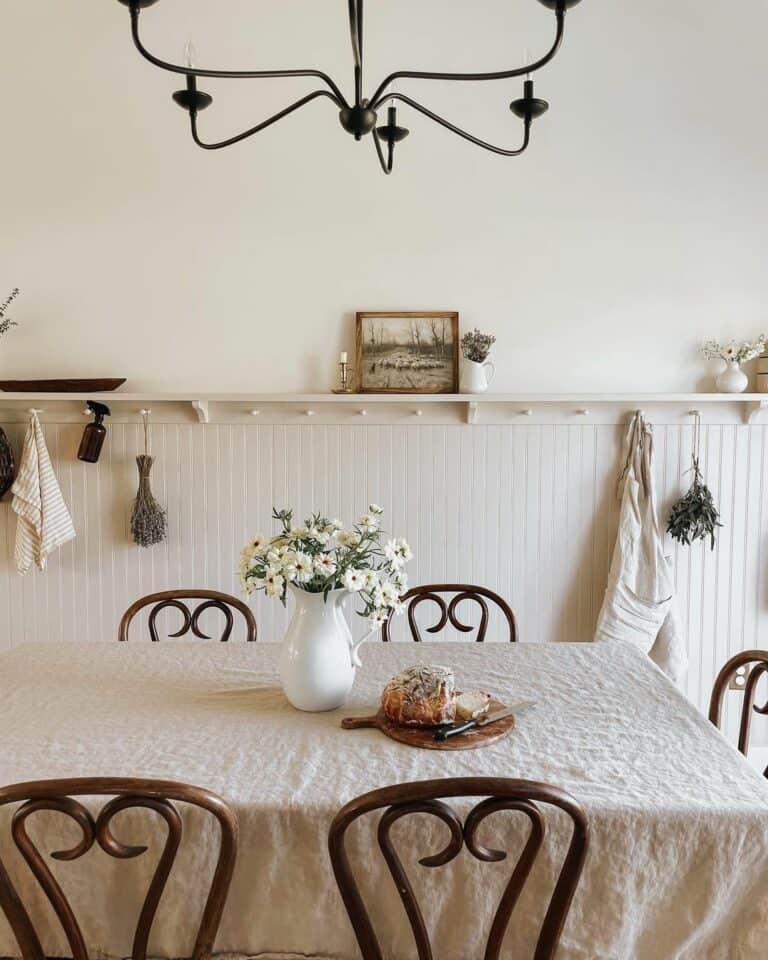 Farmhouse Dining Room With Beige Beadboard Paneling