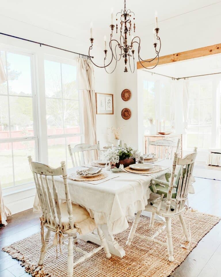 Farmhouse Dining Table With White Floral Centerpiece
