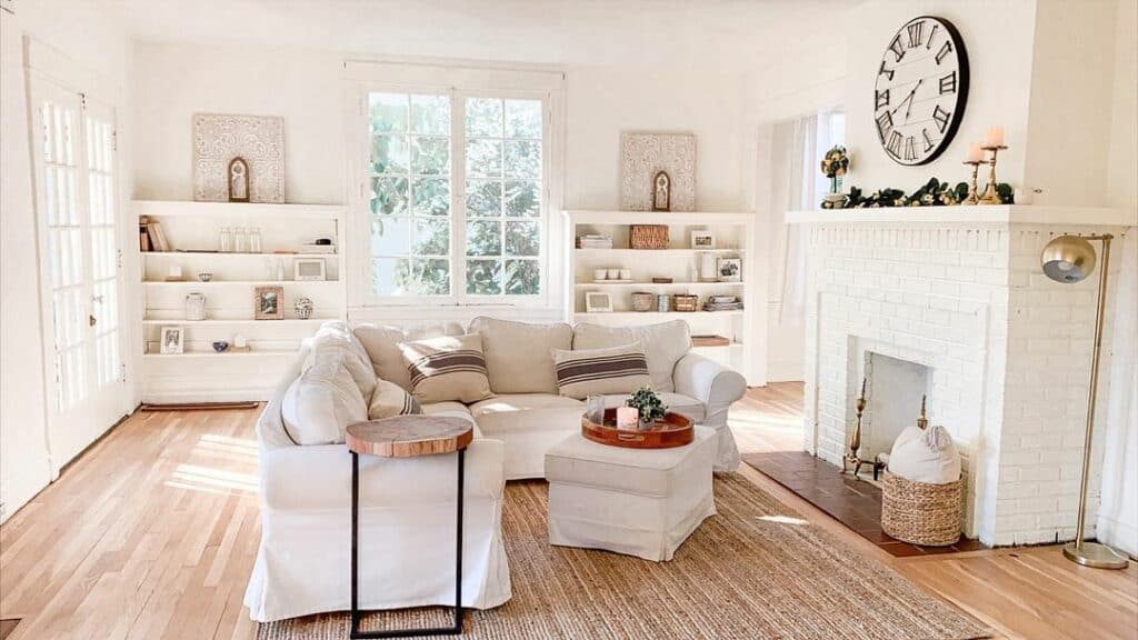 Farmhouse Living Room With White Brick Fireplace