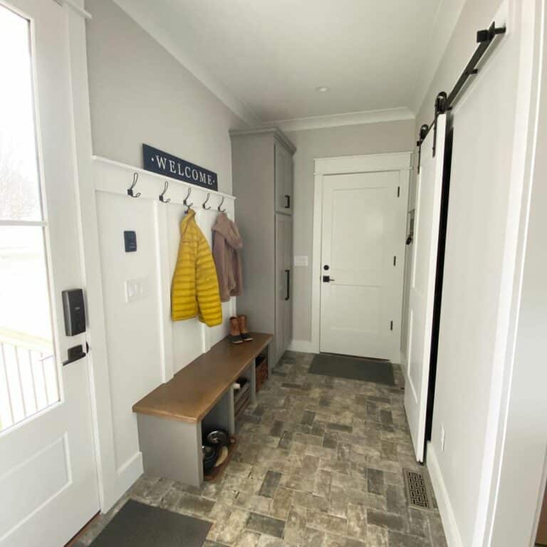 Farmhouse Mudroom With Gray Brick Flooring
