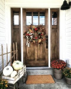 Farmhouse Porch With Rustic Wooden Door