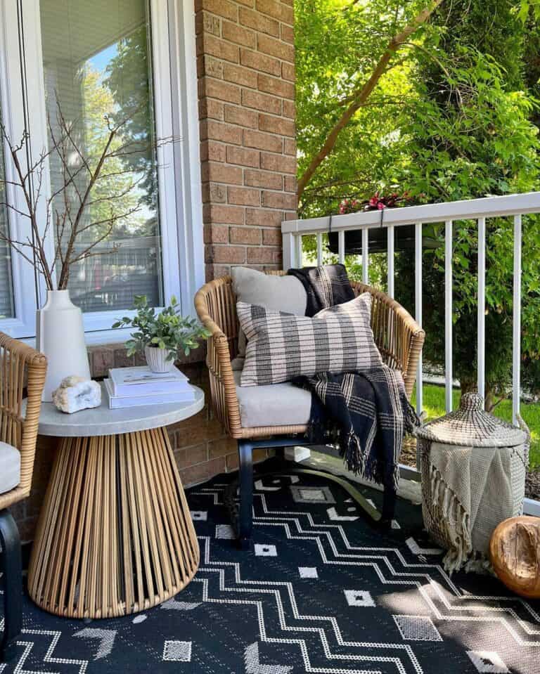 Front Porch With Black and White Patterned Rug