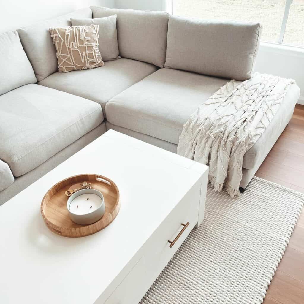 Gray Corner Sectional With White Coffee Table