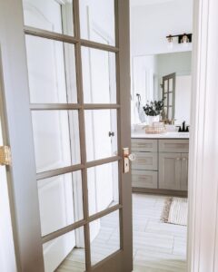 Gray Farmhouse Bathroom With Glass Door