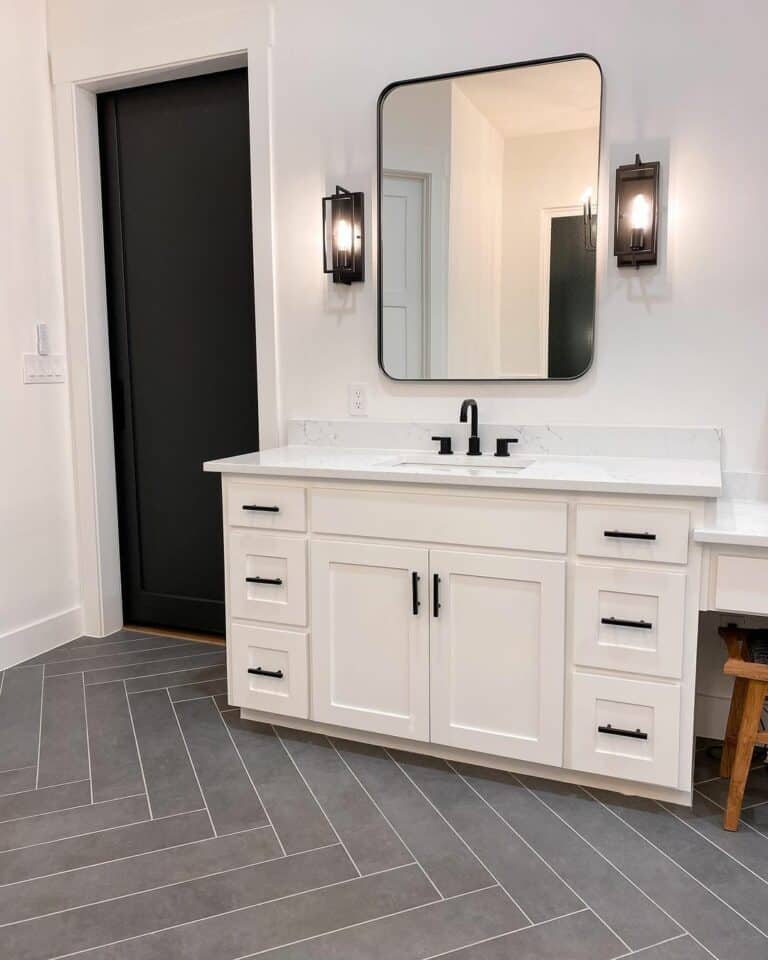 Gray Herringbone Bathroom Floor With White Grout