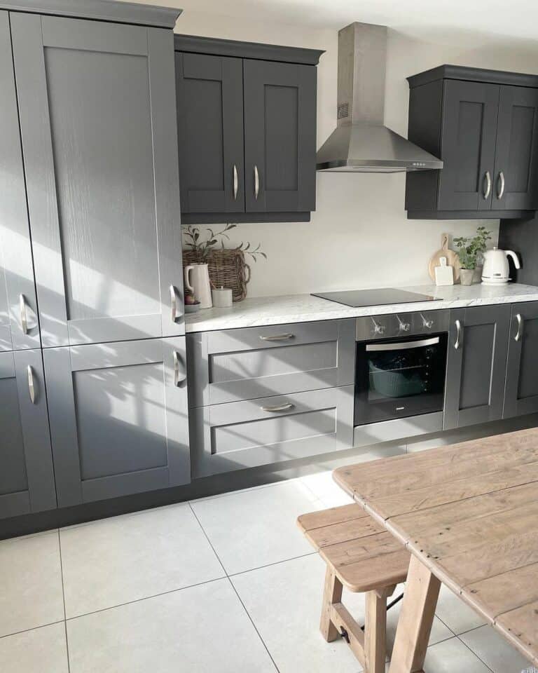 Gray Kitchen With Wooden Dining Table