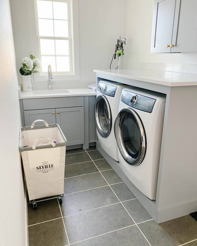 Gray Laundry Cabinets With White Countertops