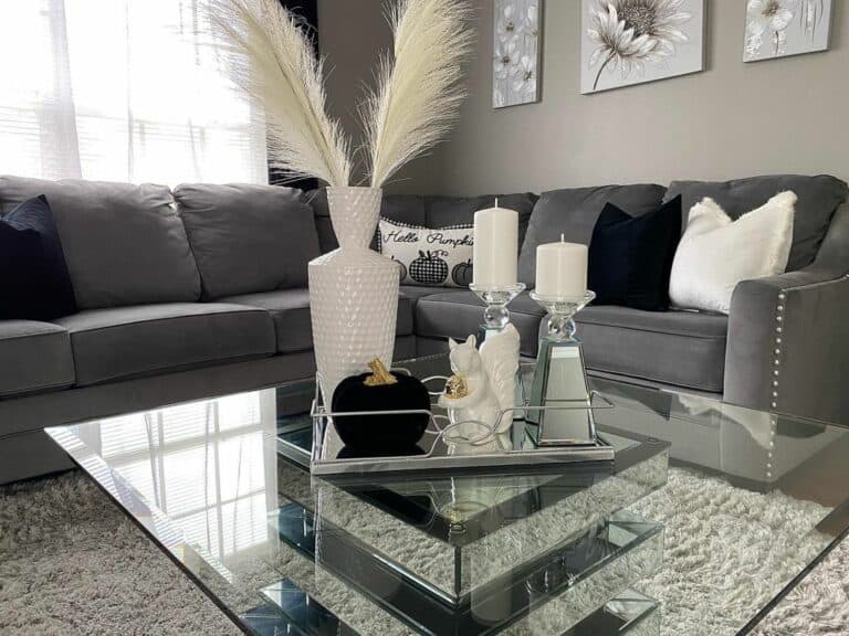 Gray Sectional Sofa in Living Room With Glass Coffee Table