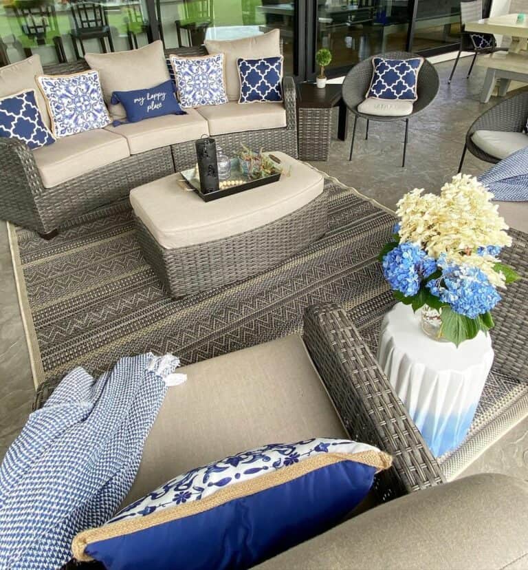 Gray Wicker Patio Furniture With Blue Accent Pillows