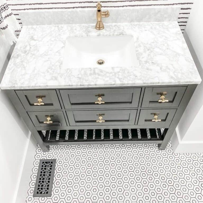 Gray and White Bathroom With White Hexagon Tile Floors