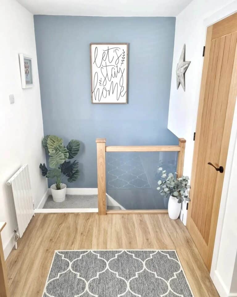 Gray and White Stairway With Maple Flooring