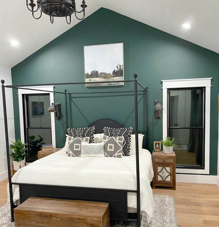 Green Bedroom With Black Metal Canopy Bed