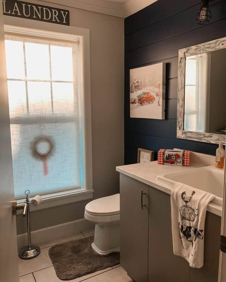 Half Bath With Dark Blue Shiplap Feature Wall