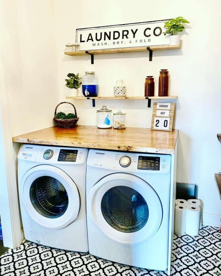 Laundry Room With Black and White Patterned Tile Floor