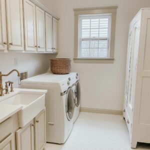 Laundry Room With White Linen Closet