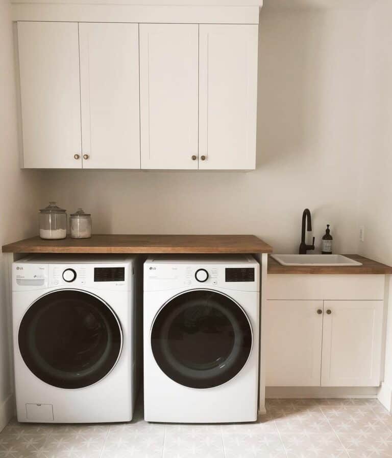 Minimalist Laundry Room With Ivory Shaker Cabinets
